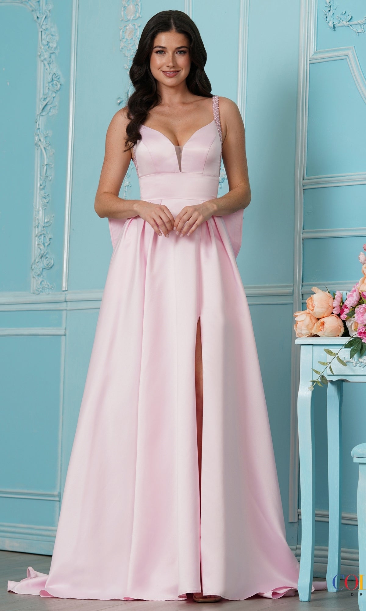 Long Prom Dress: Colors Dress 4037, a floor-length pink A-line gown with a sweetheart neckline, beaded straps, a front slit, and a bow-back design.